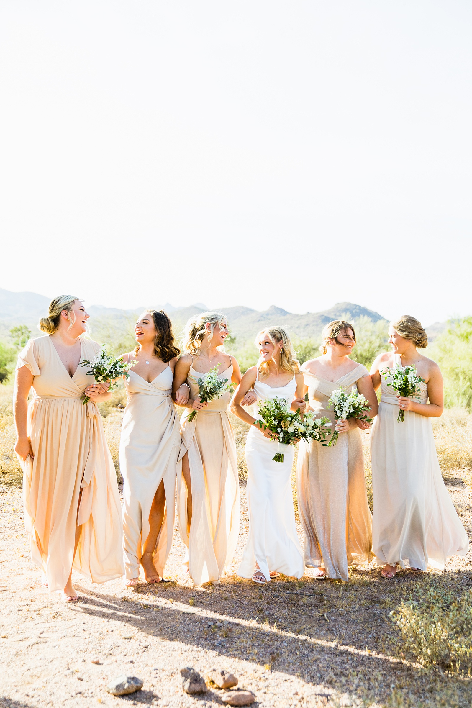 Bride and bridesmaids laughing together at Superstition Mountain Micro wedding by Lost Dutchman wedding photographer PMA Photography.