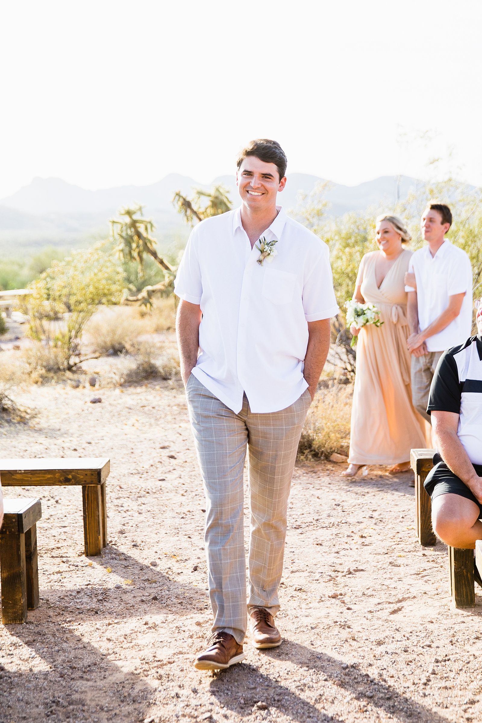 Groom walking down aisle during Superstition Mountain Micro wedding ceremony by Phoenix wedding photographer PMA Photography.