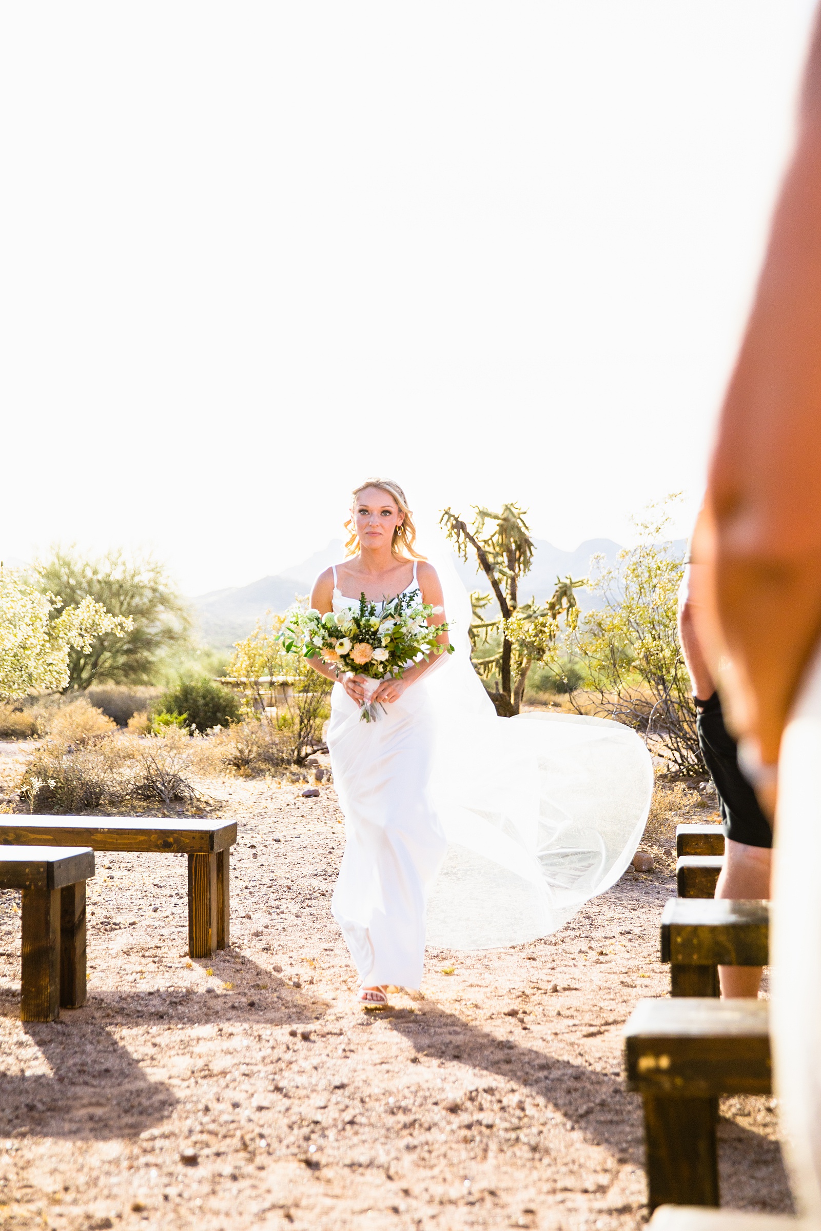 Bride walking down aisle during Superstition Mountain Micro wedding ceremony by Phoenix wedding photographer PMA Photography.