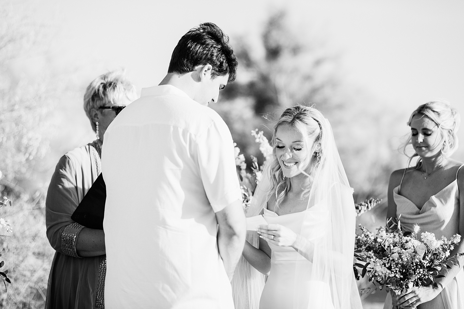 Bride and Groom exchange vows during their Superstition Mountain Micro wedding ceremony by Lost Dutchman wedding photographer PMA Photography.