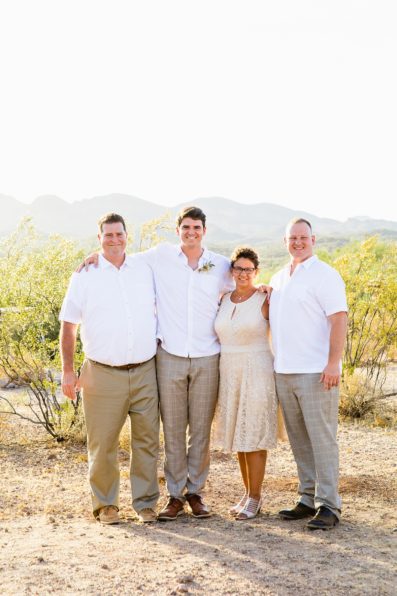 Bride and groom pose with family during their Superstition Mountain Micro wedding by Lost Dutchman wedding photographer PMA Photography.