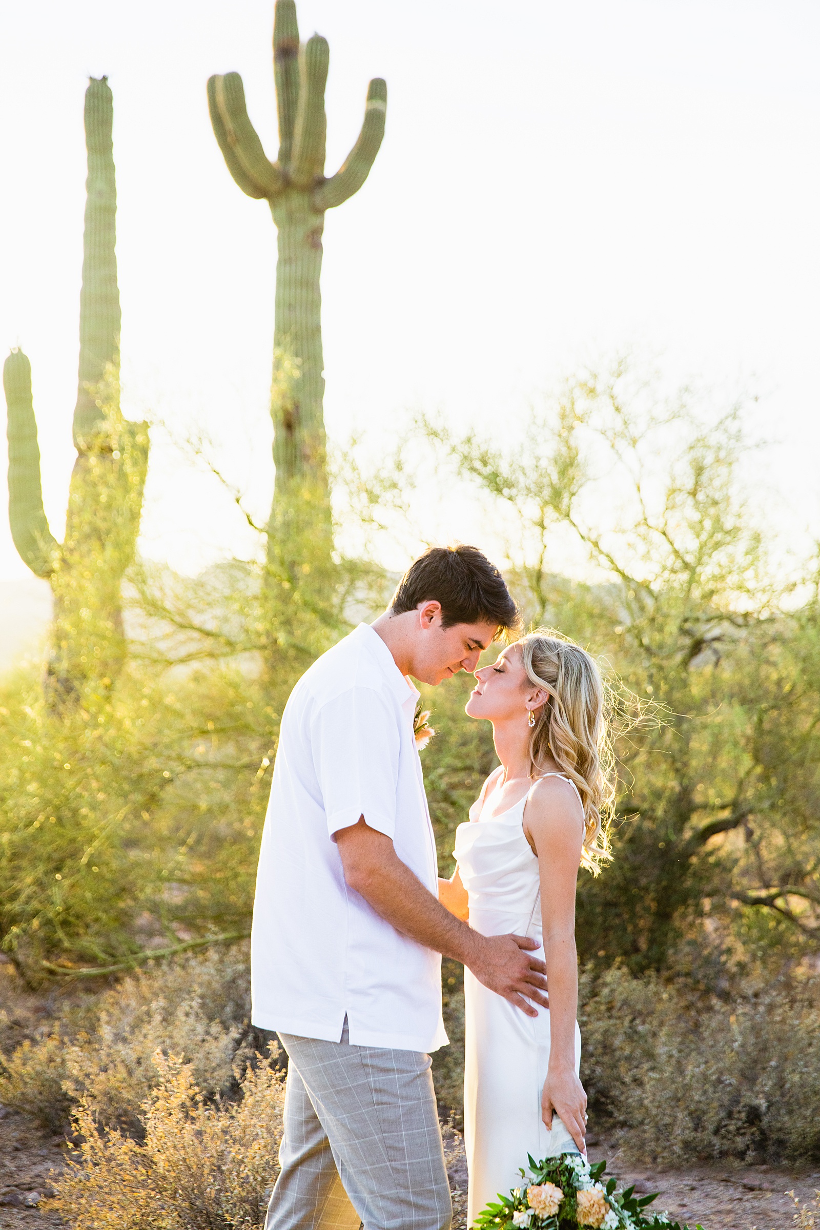 Bride and Groom share an intimate moment during their Superstition Mountain Micro wedding by Lost Dutchman wedding photographer PMA Photography.