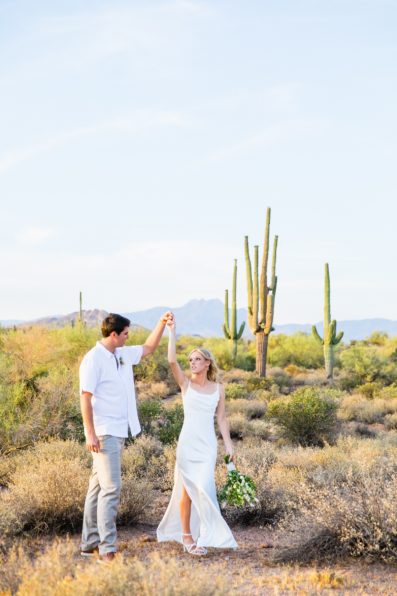 Bride and Groom dancing together during their Superstition Mountain Micro wedding by Lost Dutchman wedding photographer PMA Photography.