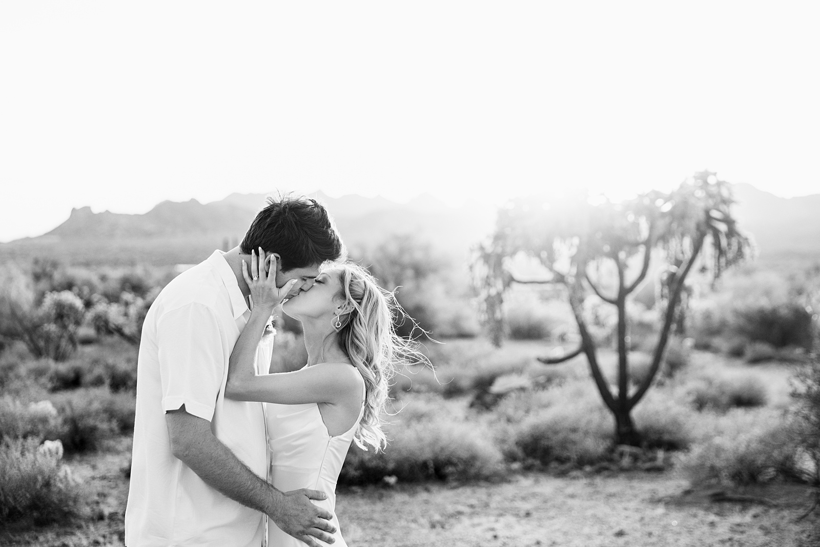 Bride and groom share a kiss during their Superstition Mountain Micro wedding by Arizona wedding photographer PMA Photography.