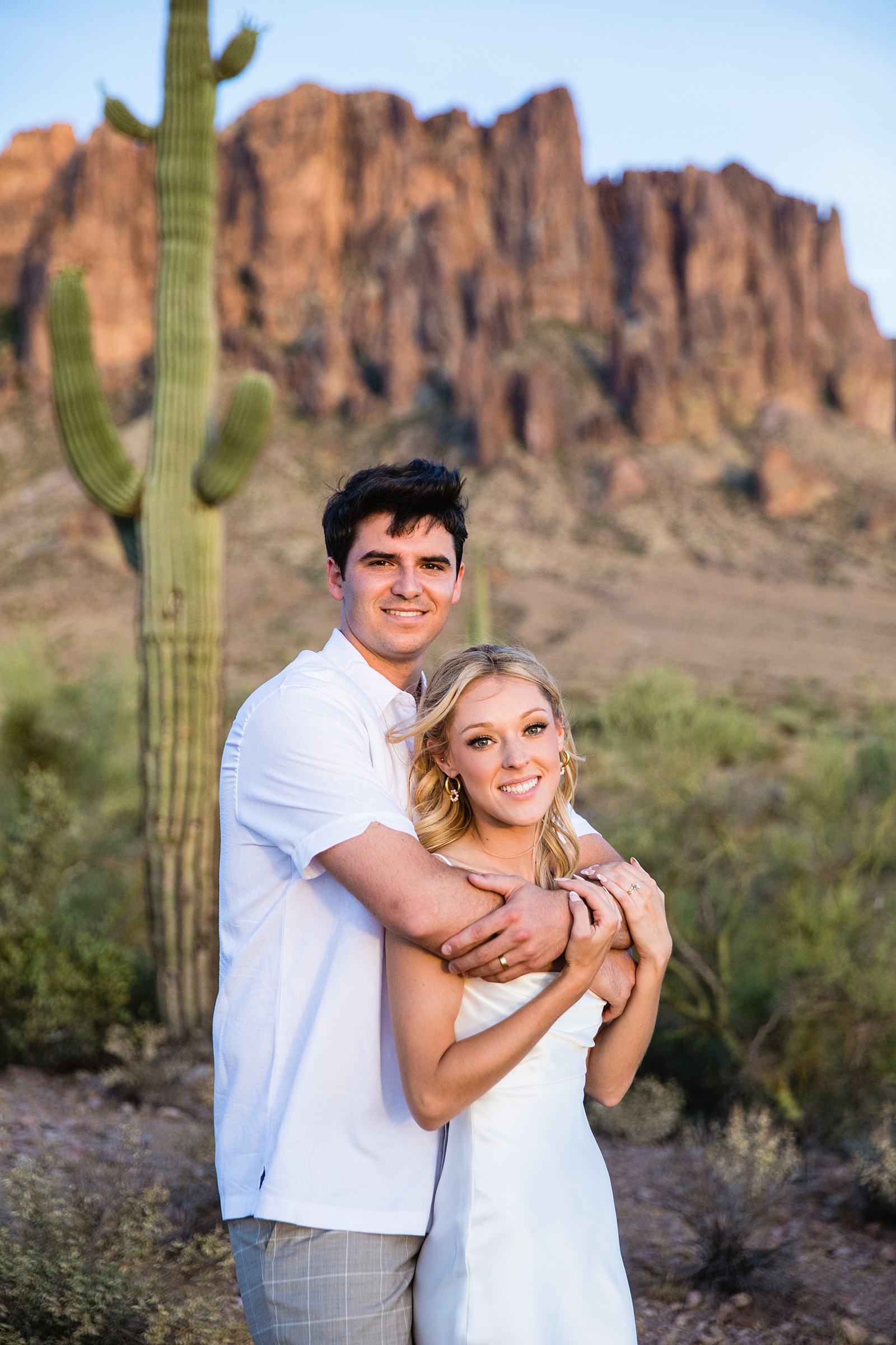 Bride and groom pose for their Superstition Mountain Micro wedding by Lost Dutchman wedding photographer PMA Photography.
