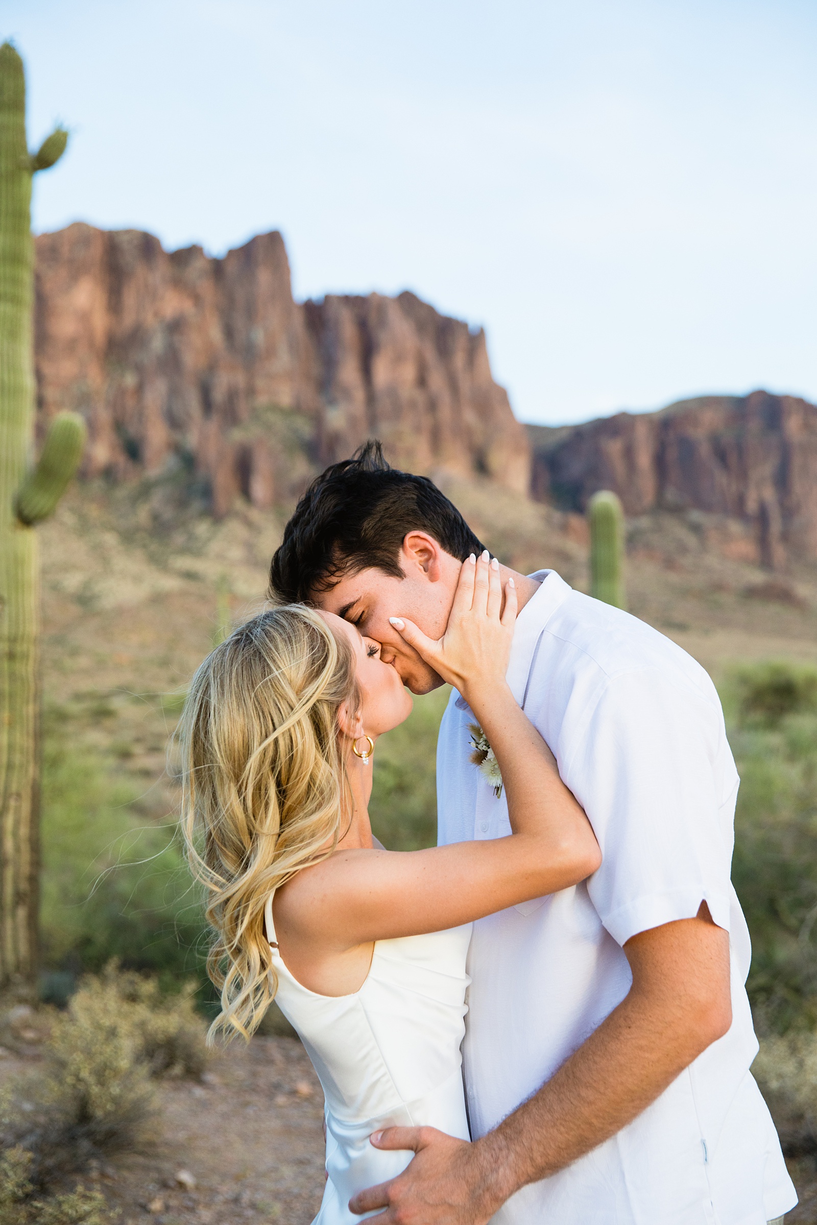 Bride and groom share a kiss during their Superstition Mountain Micro wedding by Arizona wedding photographer PMA Photography.