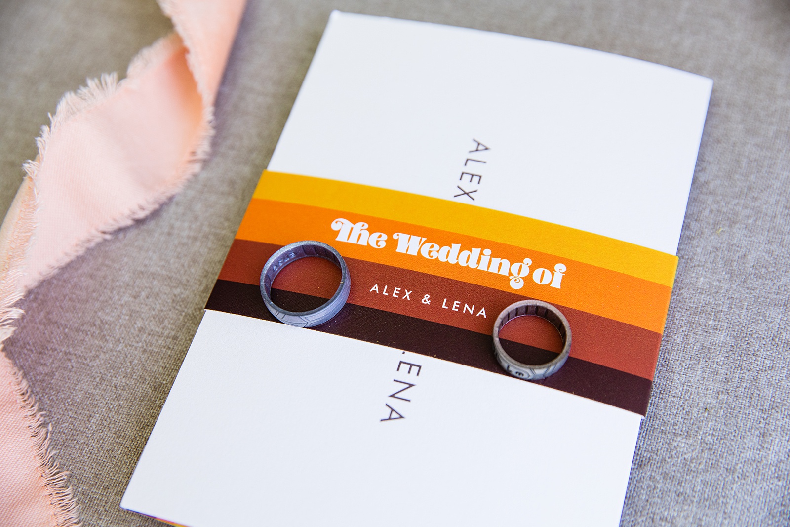 Bride's wedding day details of midmod invitation and wedding bands by PMA Photography.