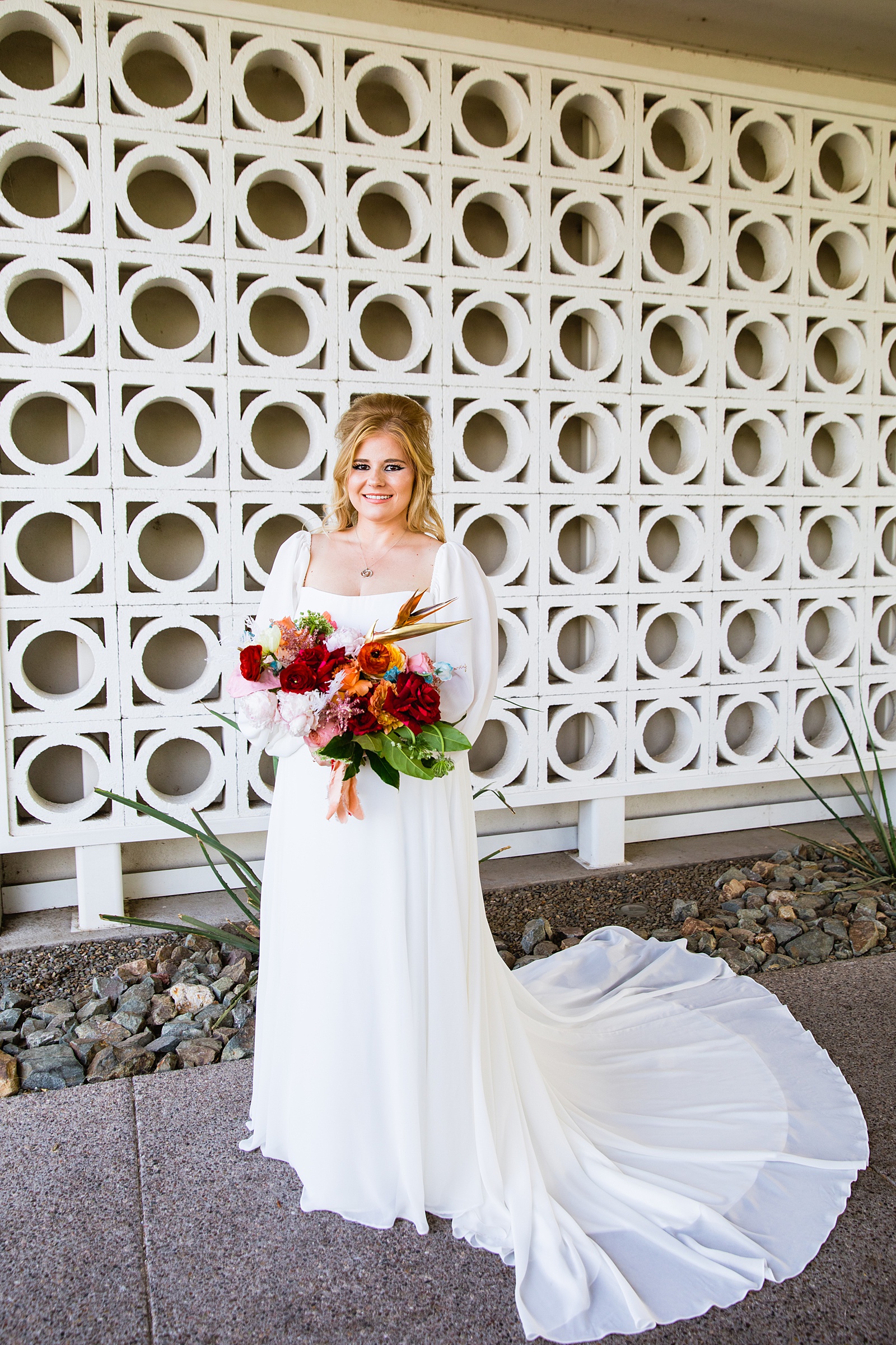 Bride in her retro puff shoulder wedding dress for her Mountain Shadows Resort wedding by PMA Photography.