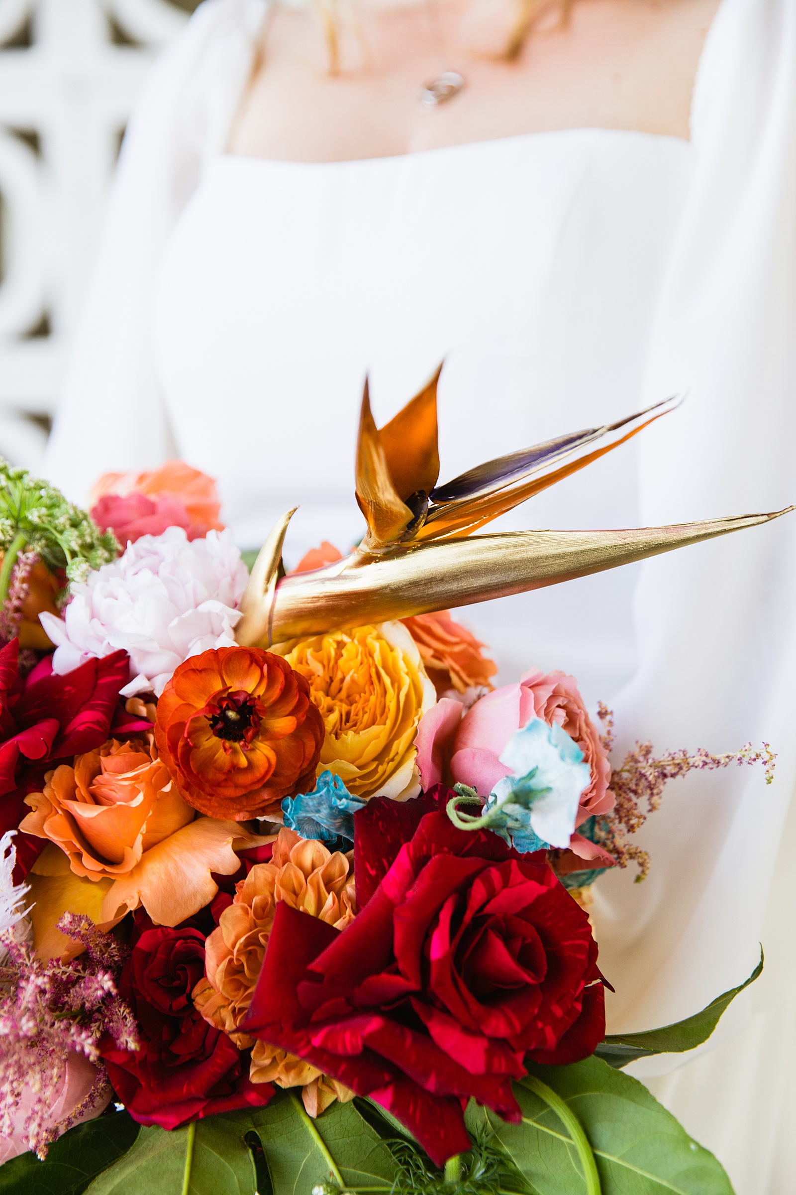 Bride with her bright and bold tropical bouquet by PMA Photography.