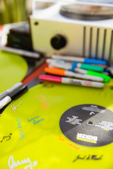 Neon record guest book by Arizona wedding photographer PMA Photography.