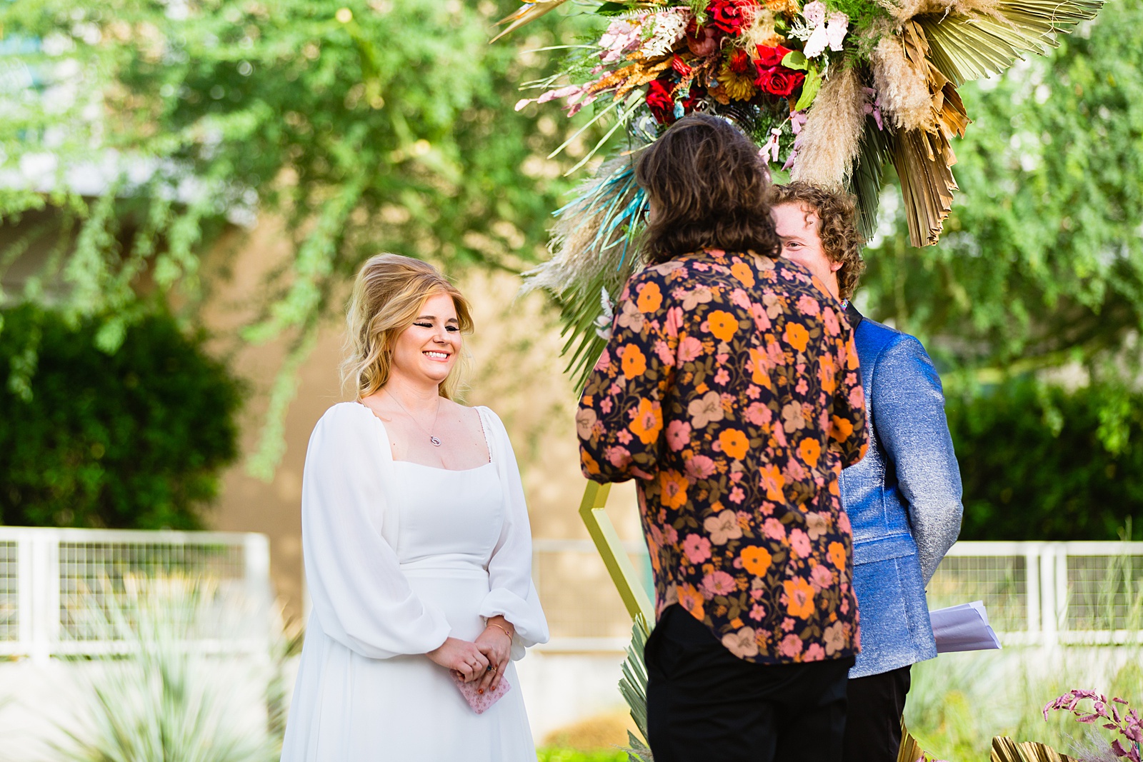 Bride looking at her groom during their wedding ceremony at Mountain Shadows Resort by Paradise Valley wedding photographer PMA Photography.