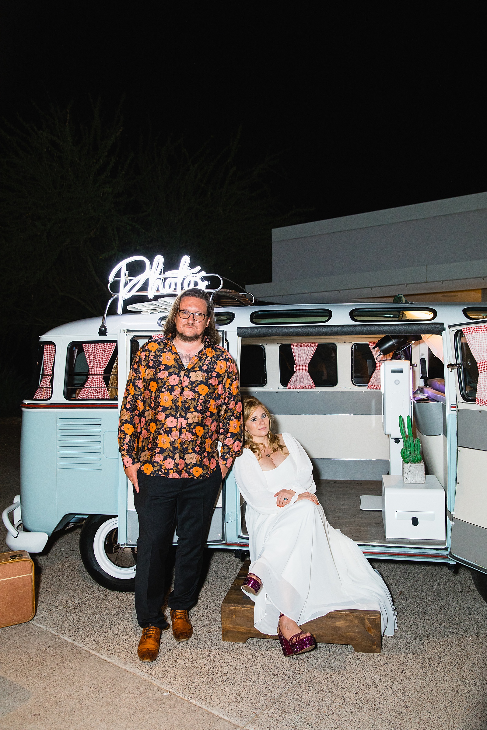 Bride and Groom take photos in retro VW Bus photo booth at Mountain Shadows Resort wedding reception by Paradise Valley wedding photographer PMA Photography