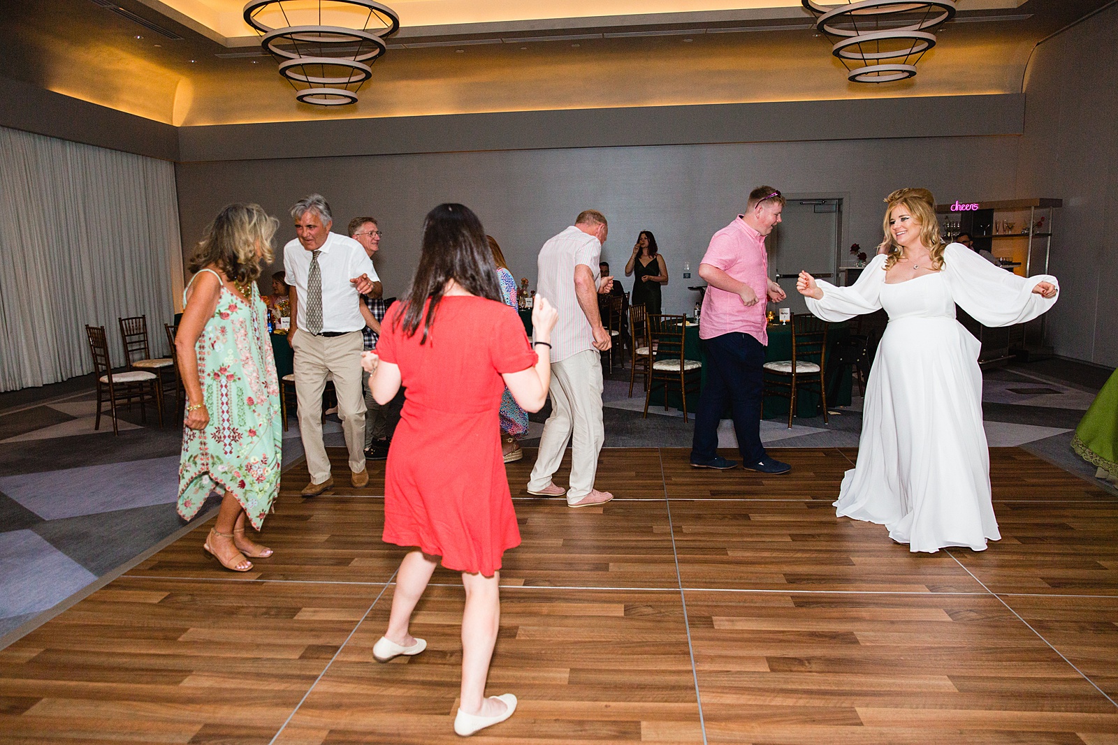 Bride dancing with guests at Mountain Shadows Resort wedding reception by Paradise Valley wedding photographer PMA Photography