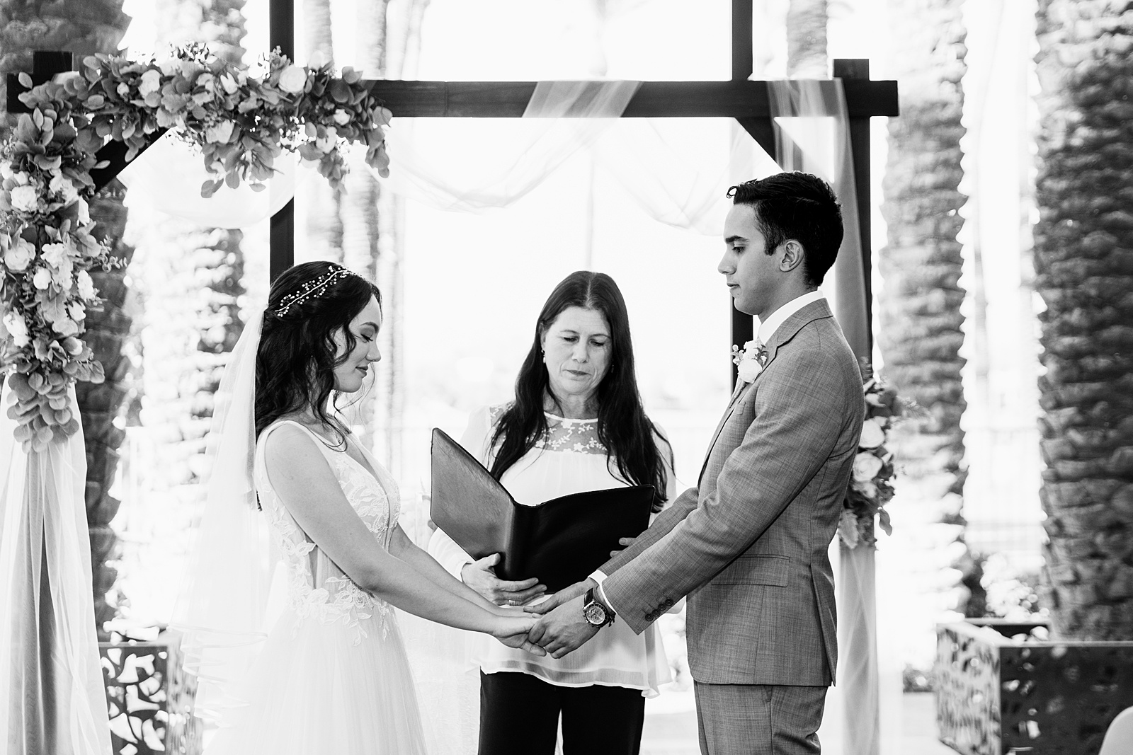 Bride and groom together during Hyatt Regency Scottsdale Resort & Spa At Gainey Ranch wedding ceremony by Scottdsale wedding photographer PMA Photography.