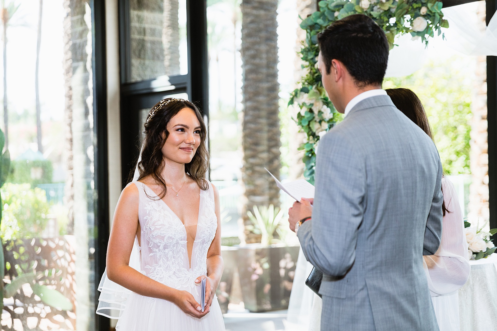 Bride looking at her groom during their wedding ceremony at Hyatt Regency Scottsdale Resort & Spa At Gainey Ranch by Scottdsale wedding photographer PMA Photography.