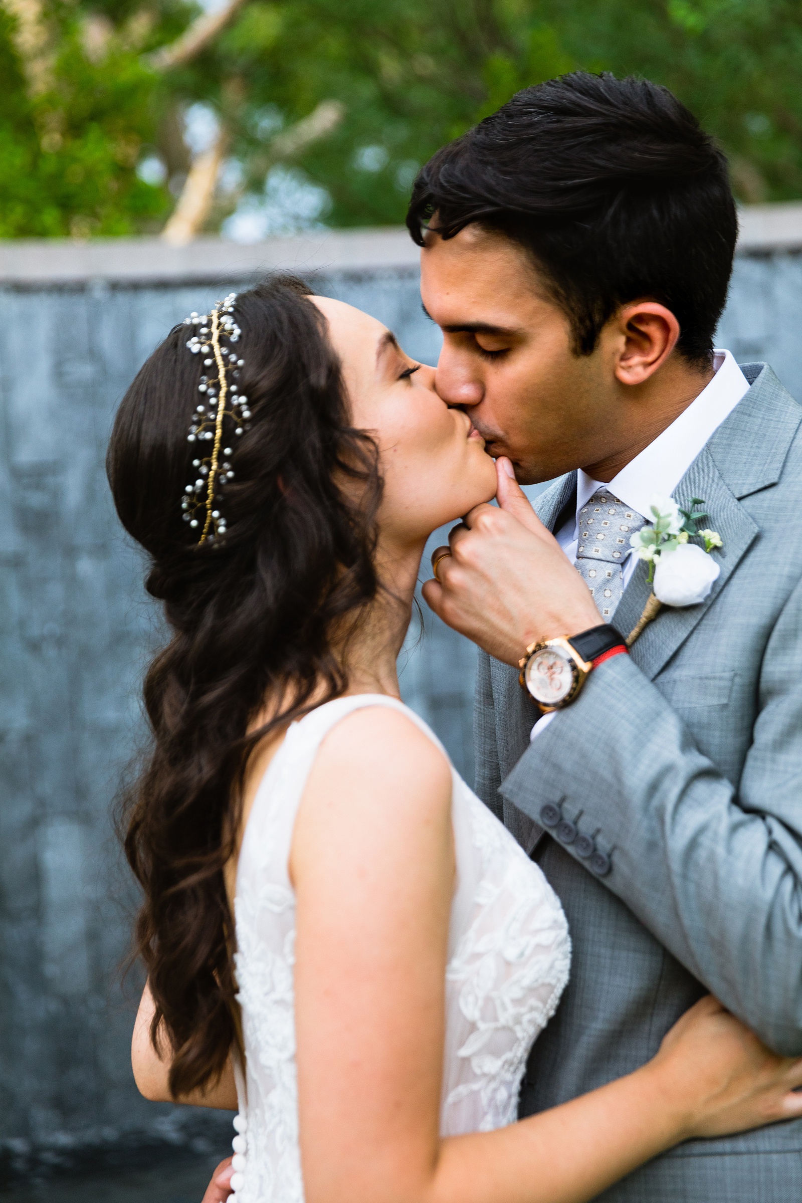 Bride and groom share a kiss during their Hyatt Regency Scottsdale Resort & Spa At Gainey Ranch wedding by Scottdsale wedding photographer PMA Photography.