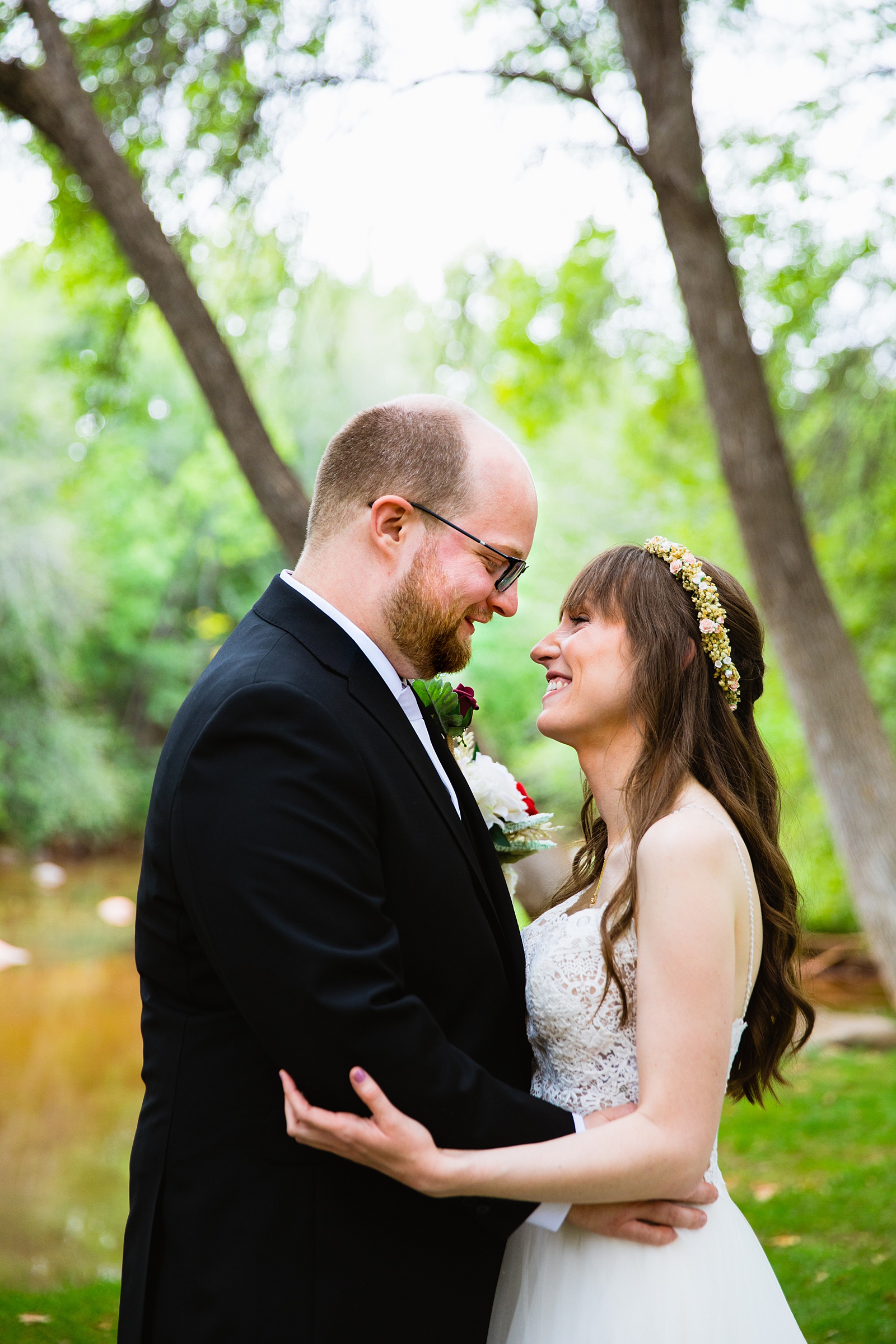 Bride and Groom looking at each other during their Los Abrigados wedding by Sedona wedding photographer PMA Photography.