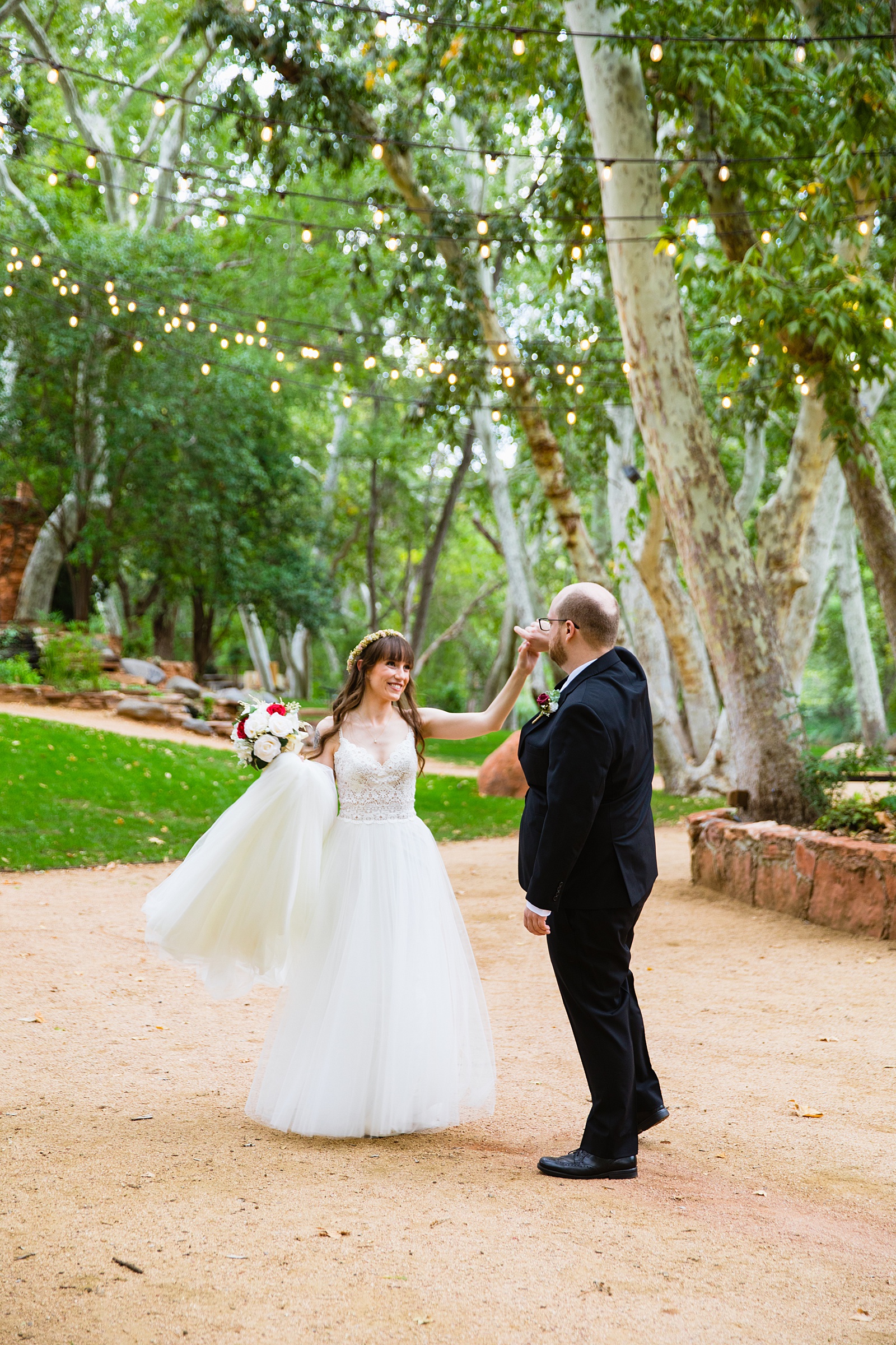 Bride and Groom dancing together during their Los Abrigados wedding by Sedona wedding photographer PMA Photography.