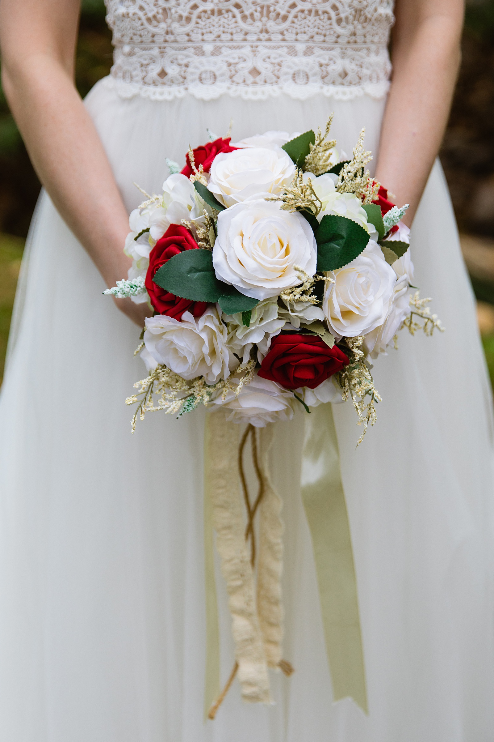 Bride's classic and simple red and white rose bouquet by PMA Photography.