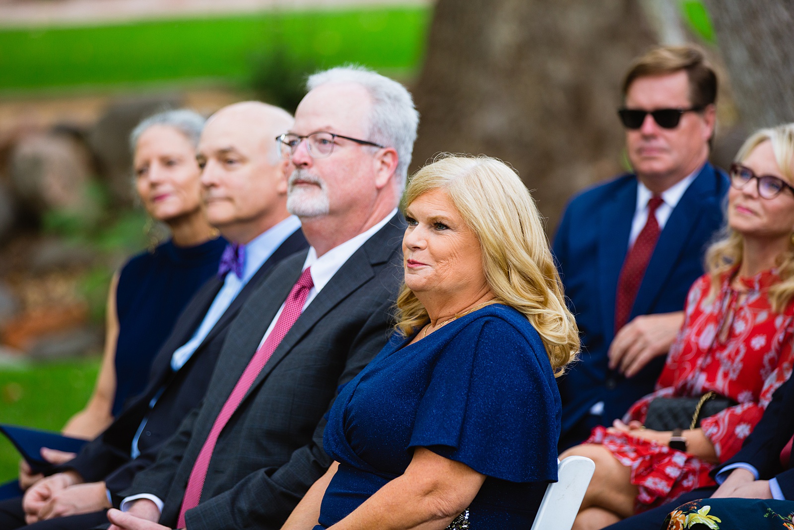 Wedding guests watching the wedding ceremony at Los Abrigados by Sedona wedding photographer PMA Photography.