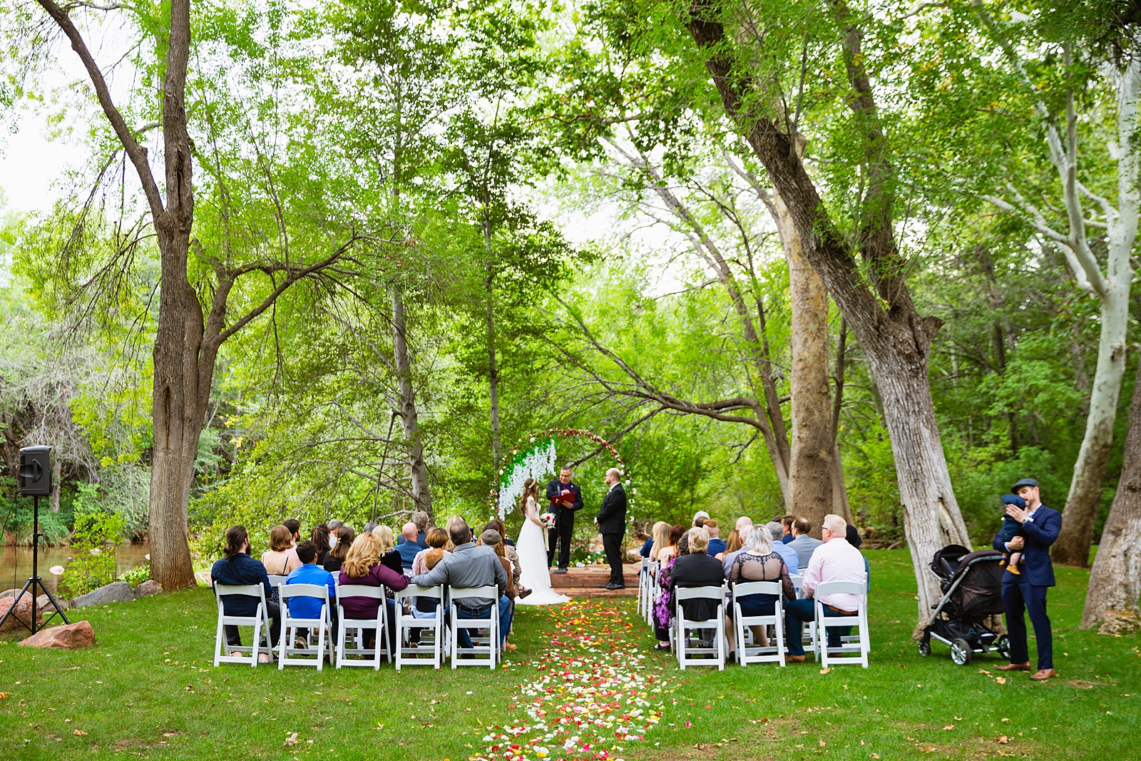 Wedding guests watching the wedding ceremony at Los Abrigados by Sedona wedding photographer PMA Photography.