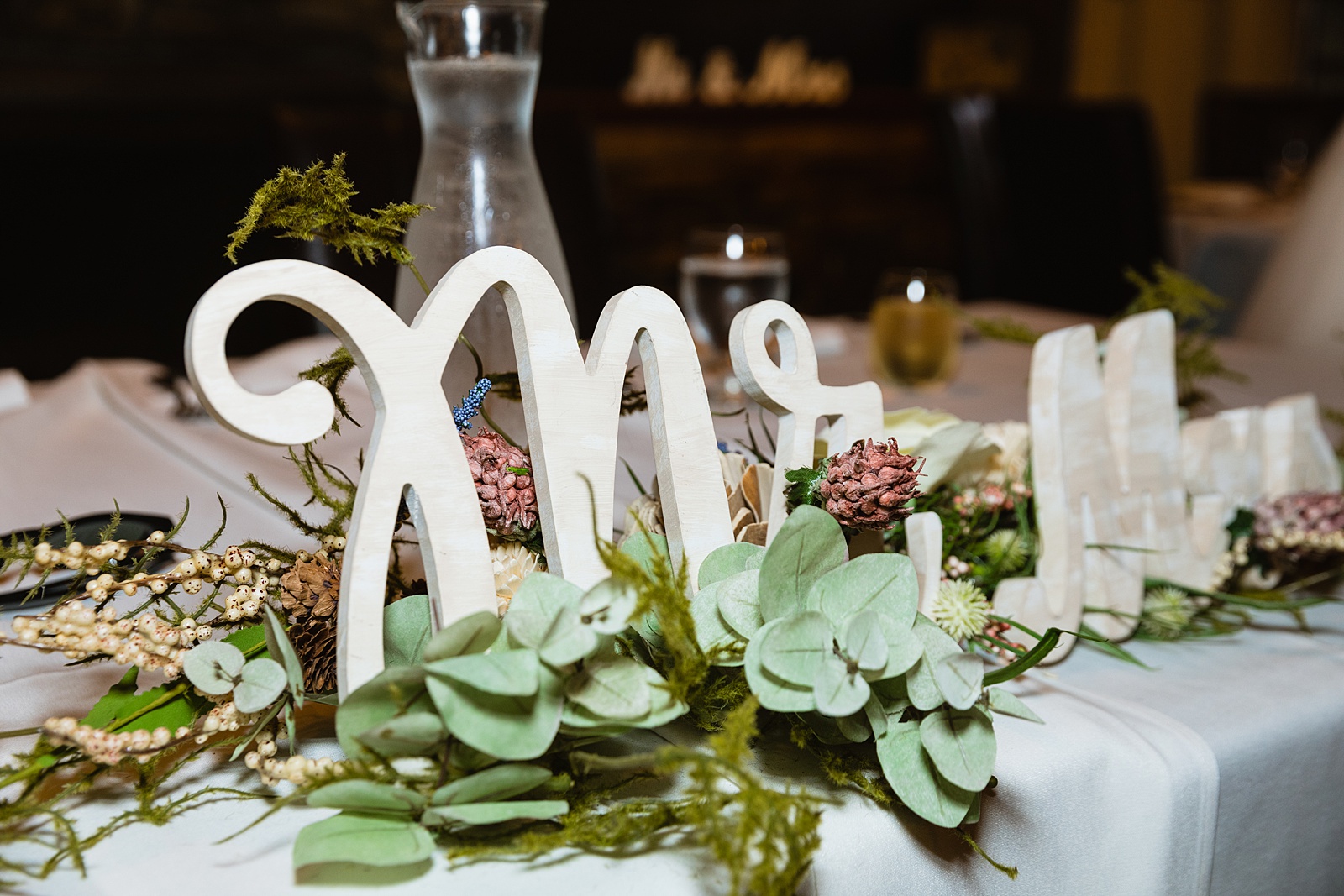 Sweetheart table at Timo Wood Oven Wine Bar wedding reception by Arizona wedding photographer PMA Photography.