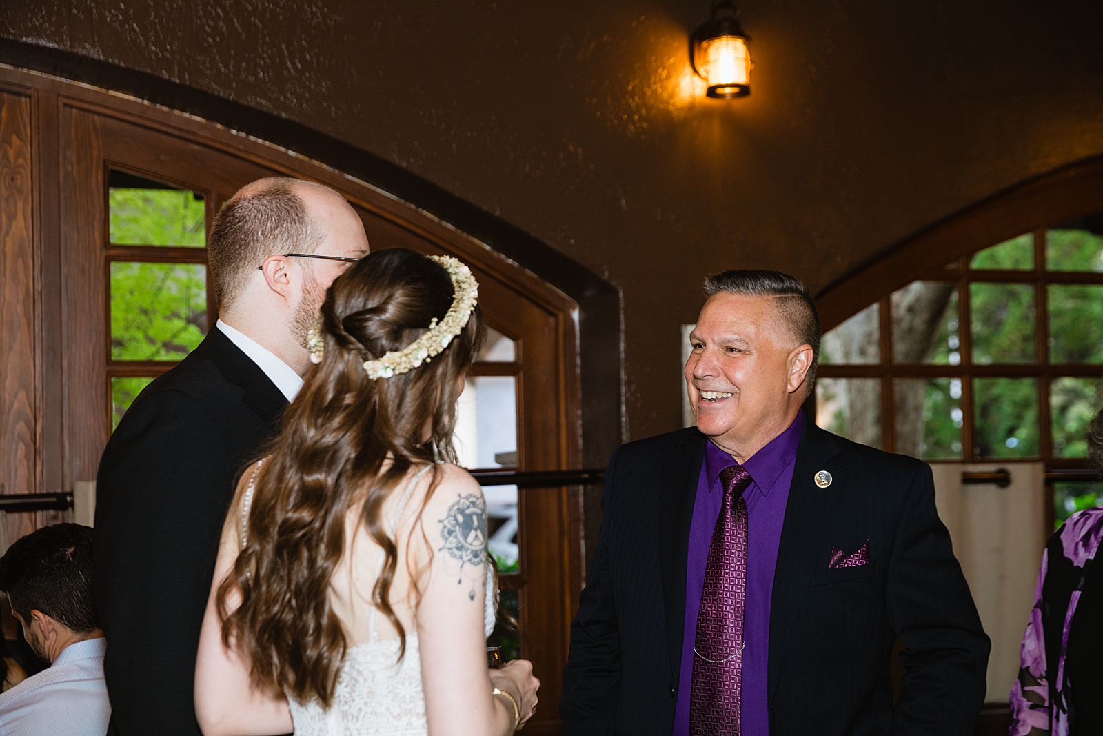 Bride and Groom with guests at Timo Wood Oven Wine Bar wedding reception by Sedona wedding photographer PMA Photography