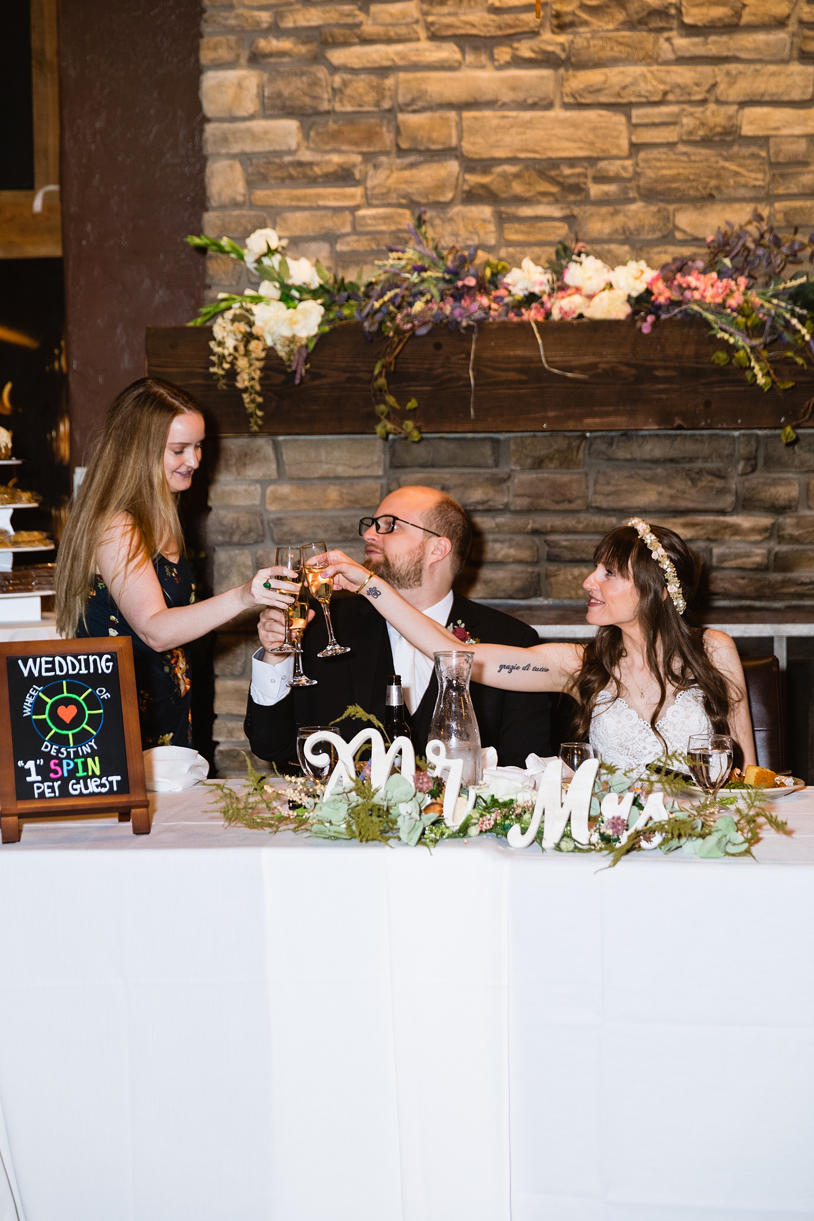 Bride and Groom share a toast with their guests at their Timo Wood Oven Wine Bar wedding reception by Arizona wedding photographer PMA Photography.
