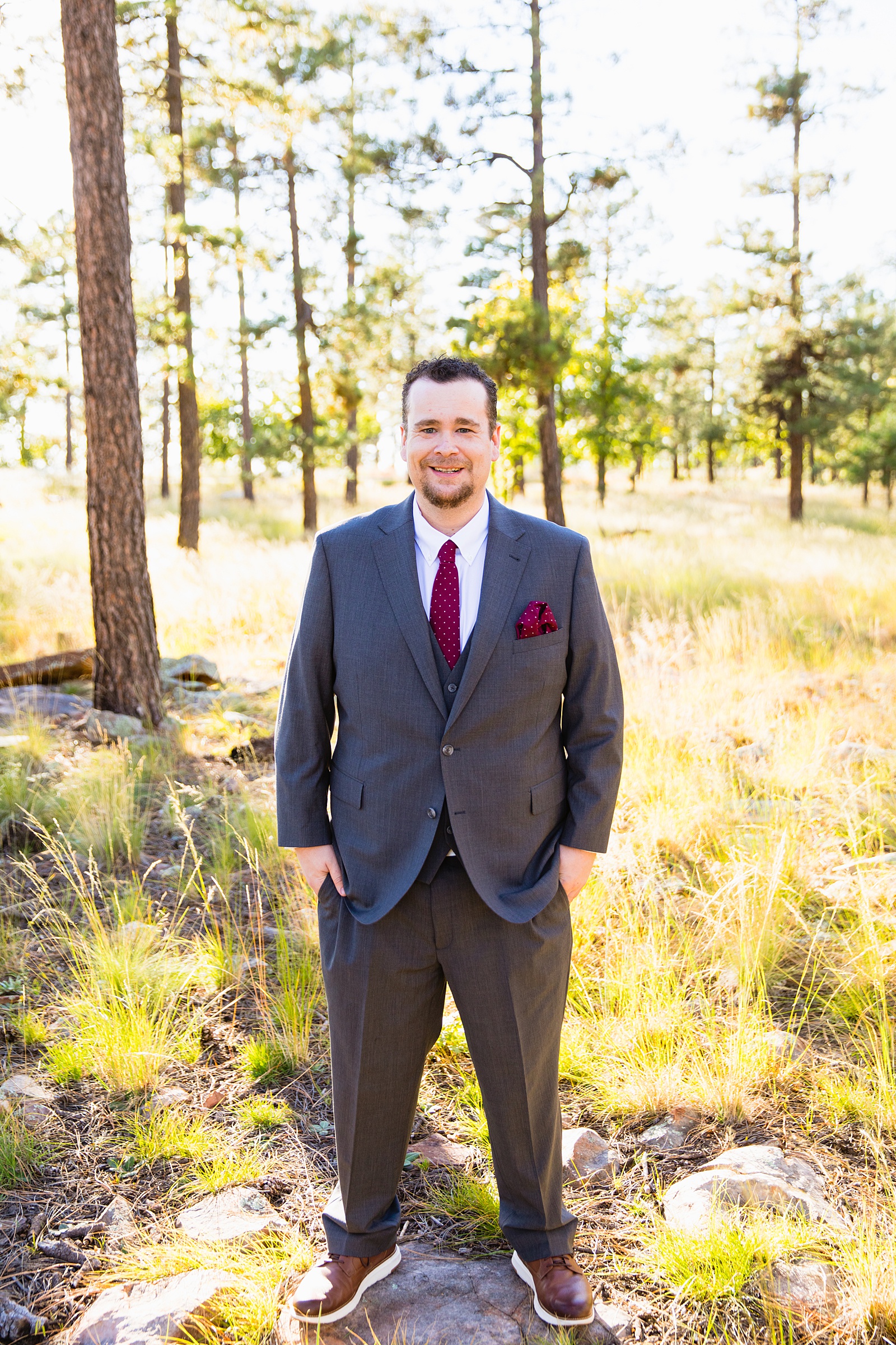 Groom's maroon and gray suit for his Mogollon Rim elopement by PMA Photography.