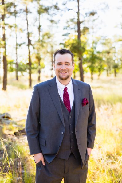 Groom's red and gray suit for his Mogollon Rim elopement by PMA Photography.