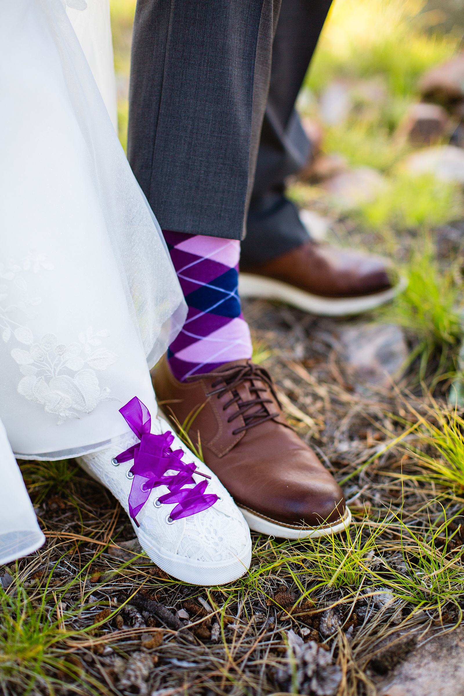 Adventurous couple pose with purple socks and shoes for their Mogollon Rim elopement by Northern Arizona elopement photographer PMA Photography.