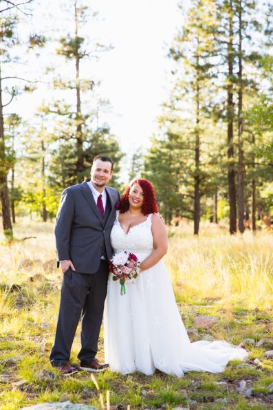 Adventurous couple pose for their Mogollon Rim elopement by Northern Arizona elopement photographer PMA Photography.