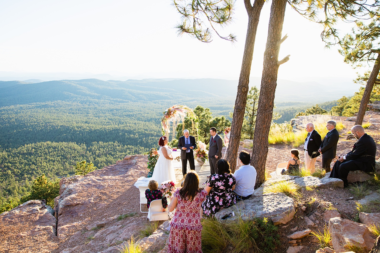 Family and guests during Mogollon Rim wedding ceremony by Arizona elopement photographer PMA Photography.