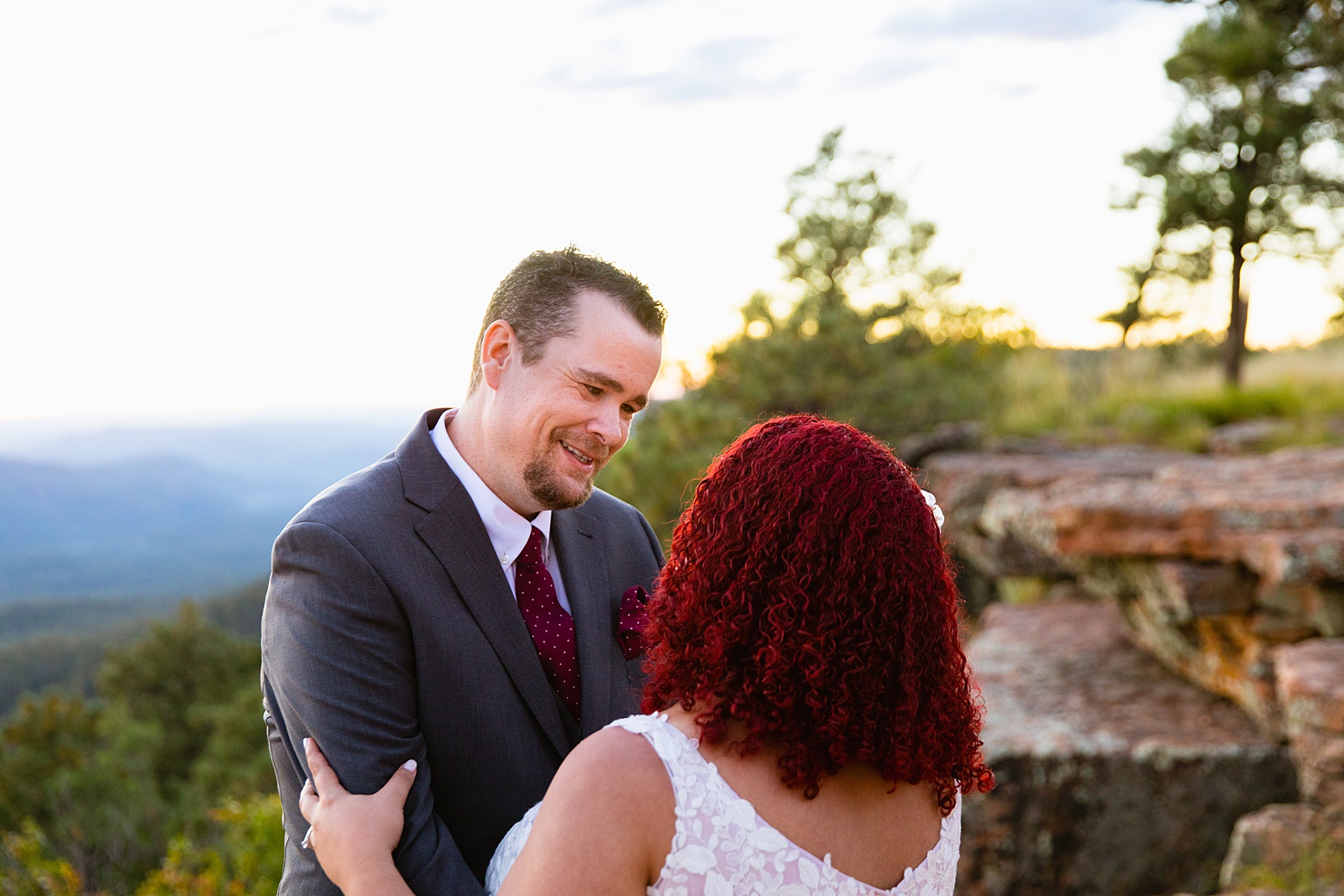 Adventurous couple looking at each other at their Mogollon Rim elopement by Northern Arizona elopement photographer PMA Photography.