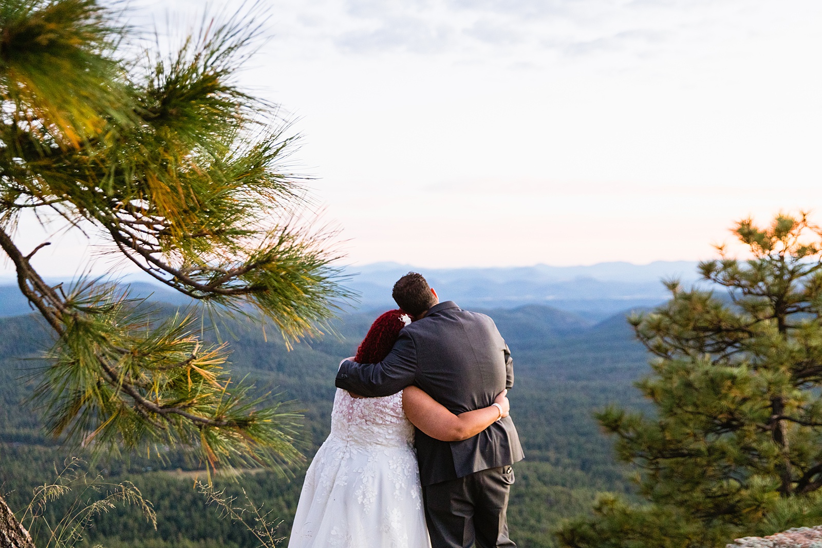 newlywed couple pose after their Mogollon Rim elopement by Arizona elopement photographer PMA Photography.
