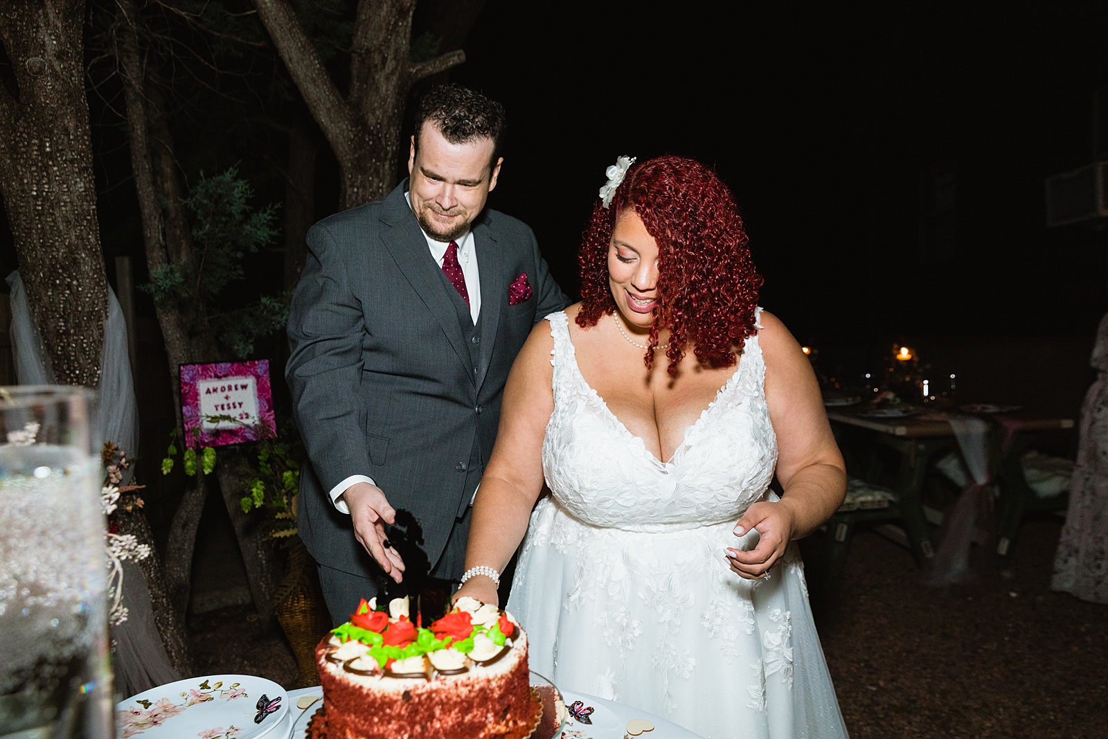 Adventurous elopement couple cutting their wedding cake at their Mogollon Rim wedding reception by Arizona wedding photographer PMA Photography.