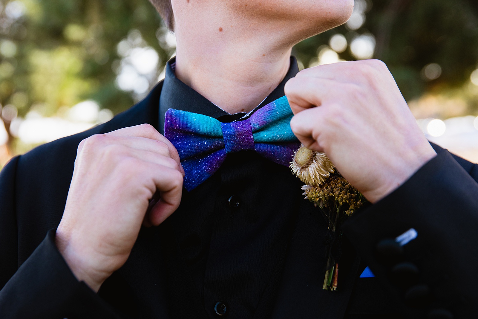 Bride's wedding day details of galaxy bow tie, dried flower boutonniere by PMA Photography.