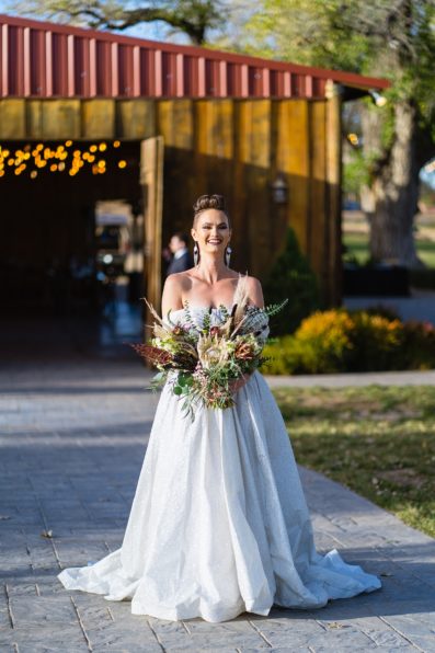 Bride walking down aisle during Mortimer Farms wedding ceremony by Arizona wedding photographer PMA Photography.