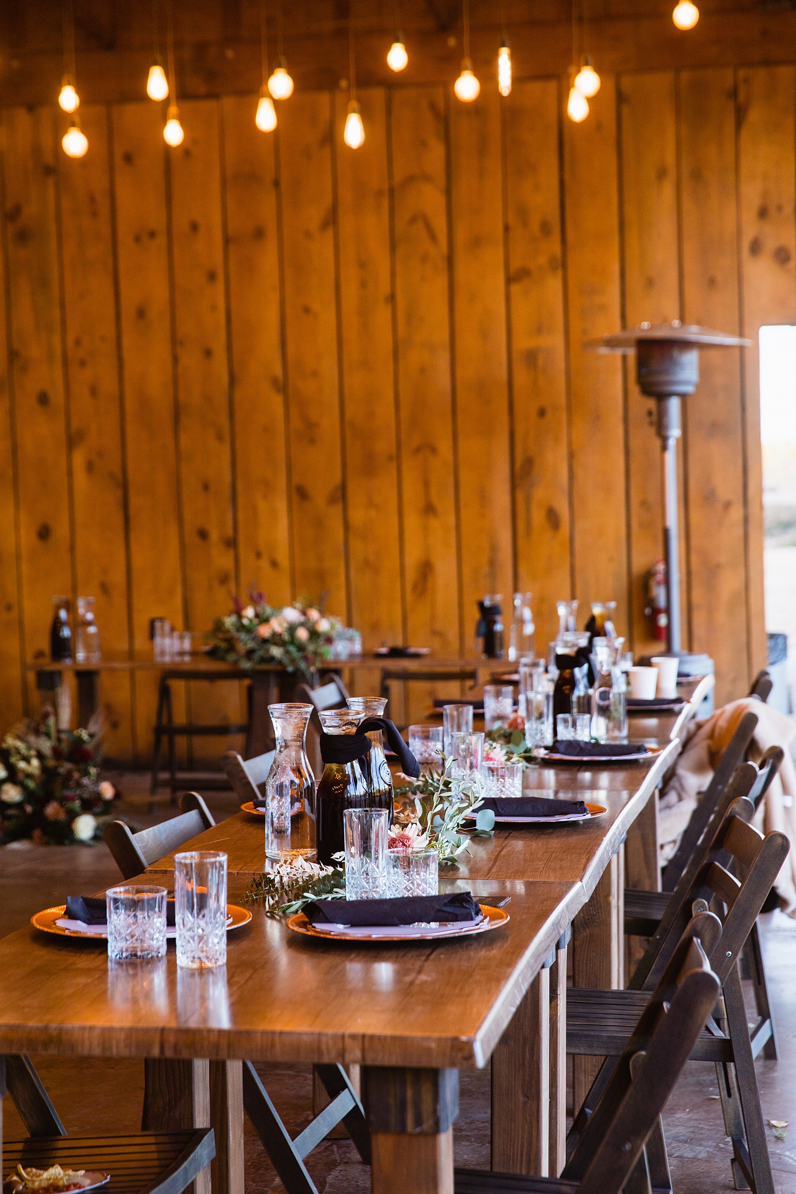 Tablescape and reception decorations at Mortimer Farms wedding reception by Prescott wedding photographer PMA Photography.