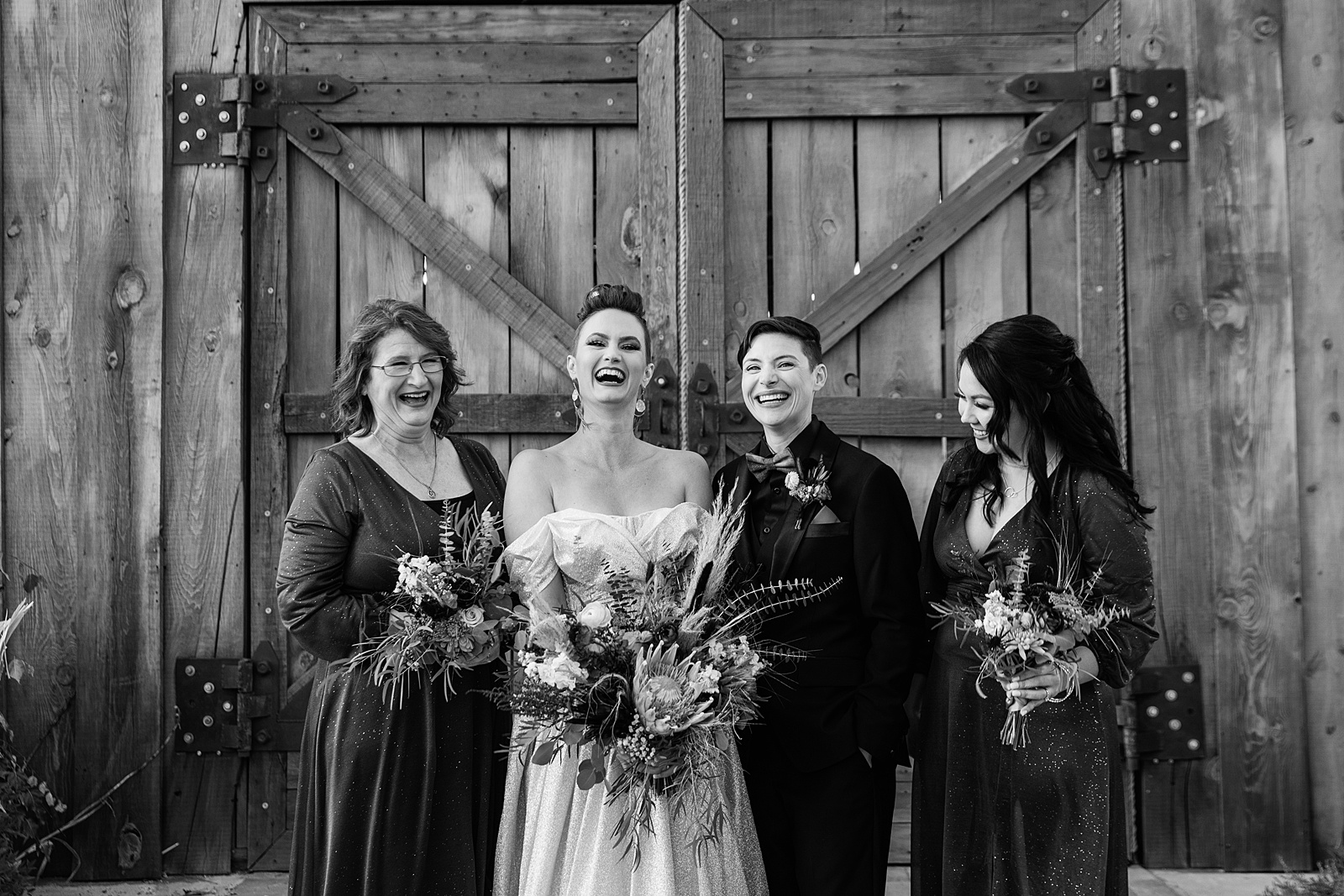 Bridal party laughing together at Mortimer Farms wedding by Prescott wedding photographer PMA Photography.