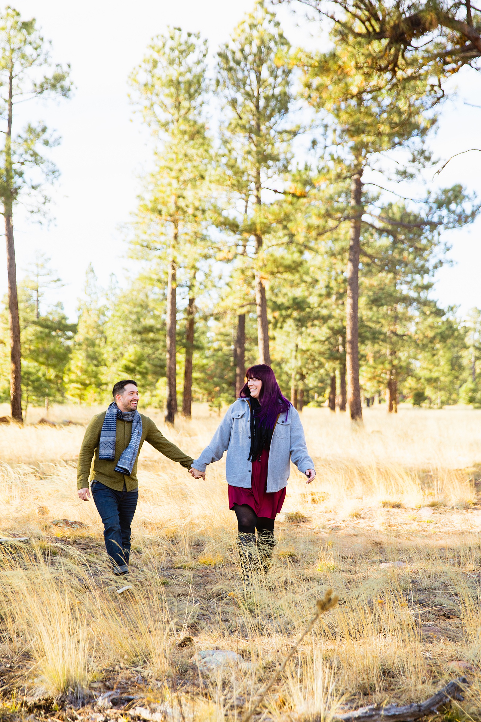 Adventurous couple walking together during their Payson engagement session by Arizona engagement photographer PMA Photography.