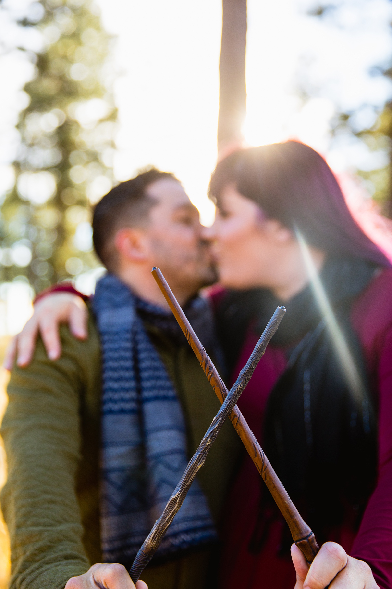 Adventurous couple pose with Harry Potter wands for their Mogollon Rim engagement session by Payson wedding photographer PMA Photography.