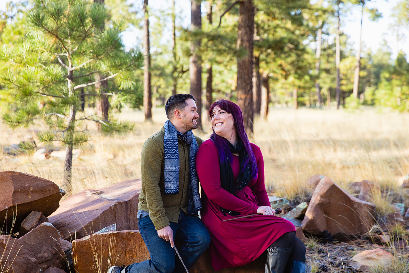 Adventurous couple pose during their Payson engagement session by Arizona wedding photographer PMA Photography.