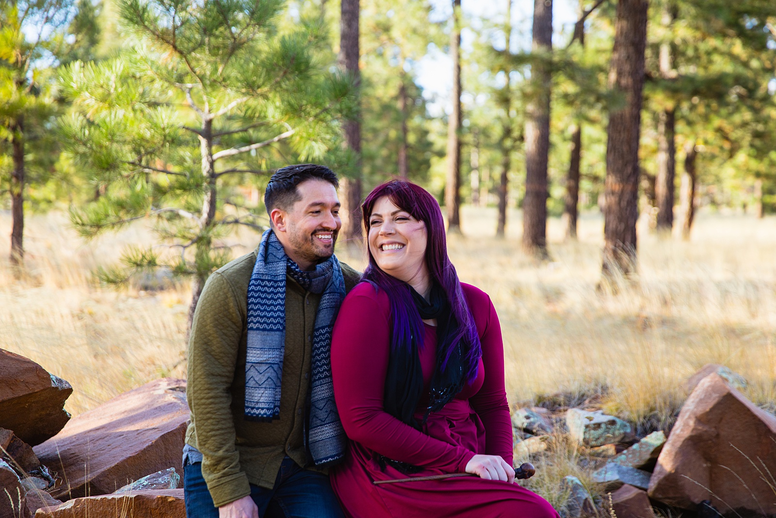 Adventurous couple laugh together during their Payson engagement session by Arizona engagement photographer PMA Photography.