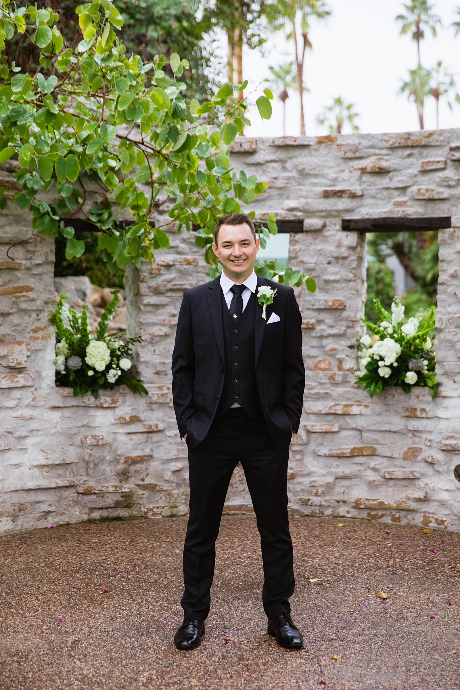 Groom's all black suit for his The Scott wedding by PMA Photography.