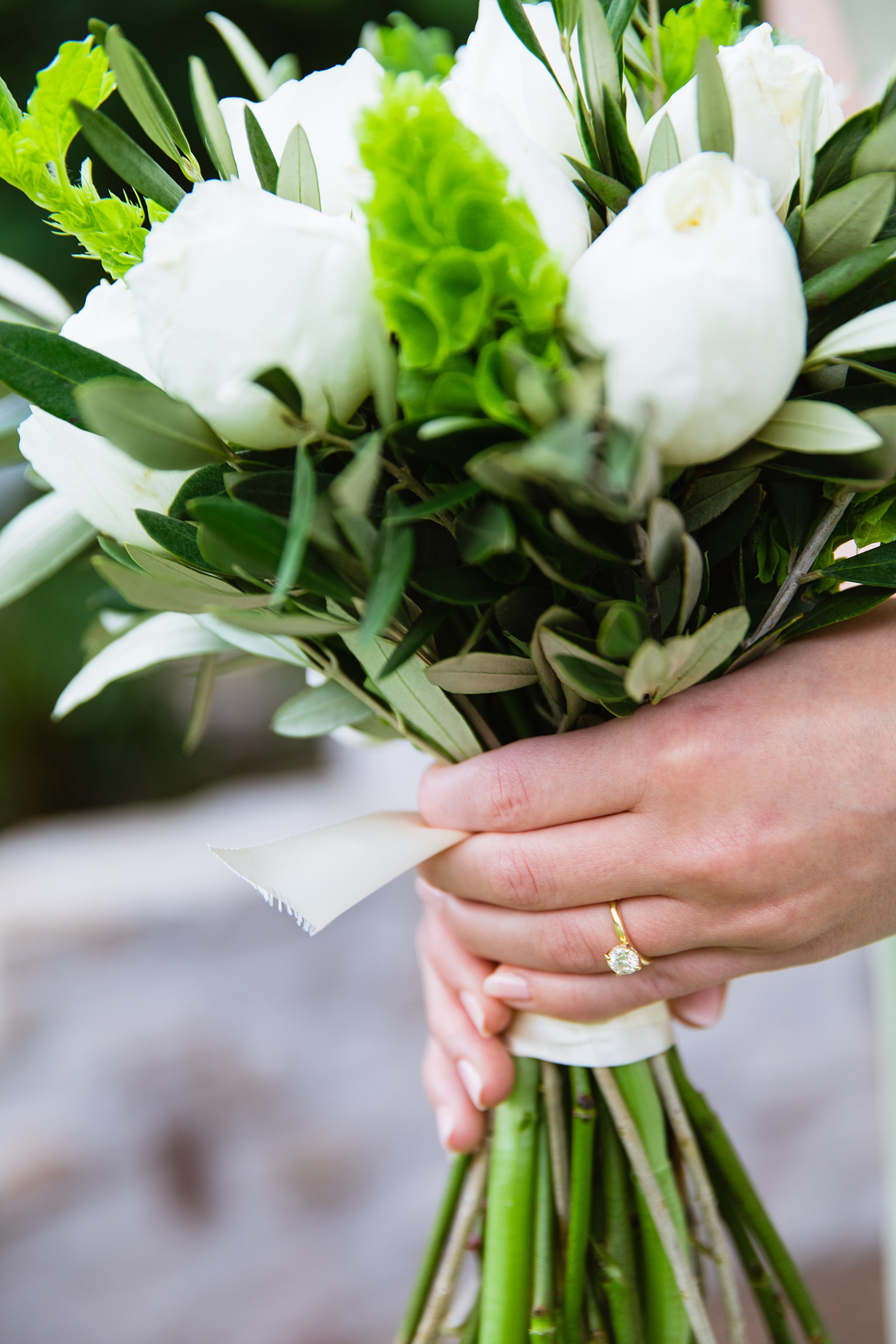 Bride's green and white bouquet by PMA Photography.
