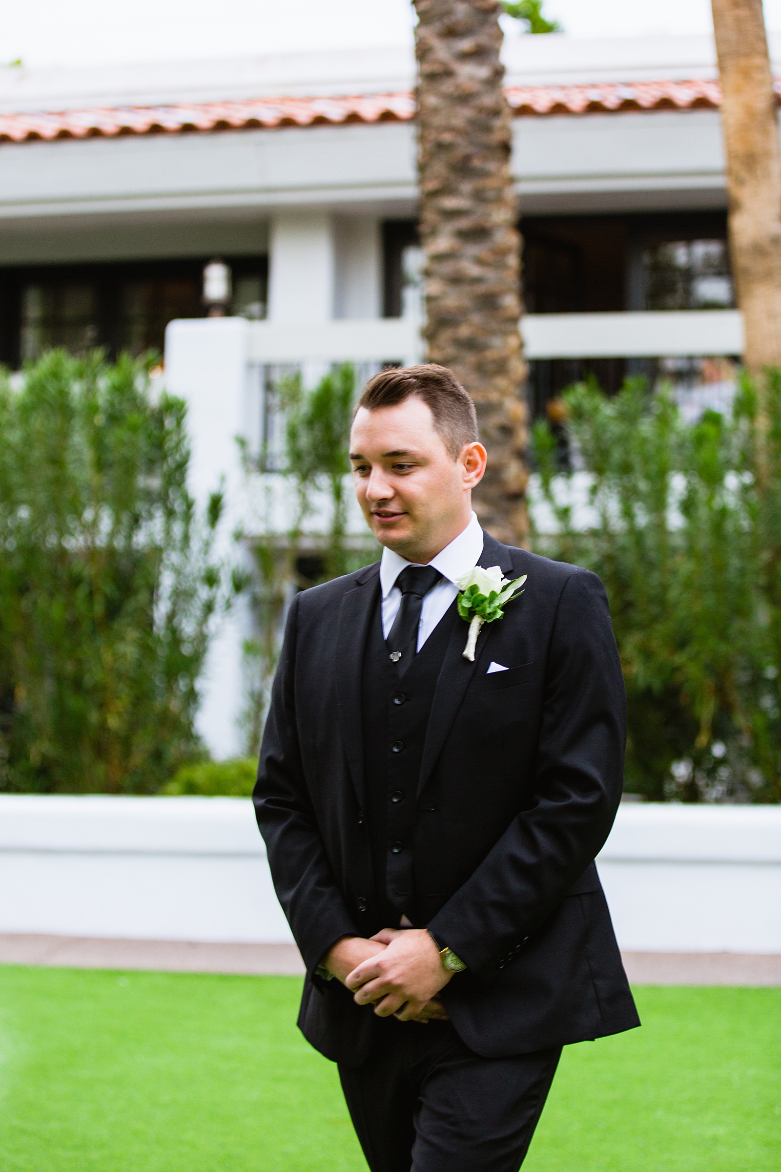 Groom walking down aisle during The Scott wedding ceremony by Phoenix wedding photographer PMA Photography.