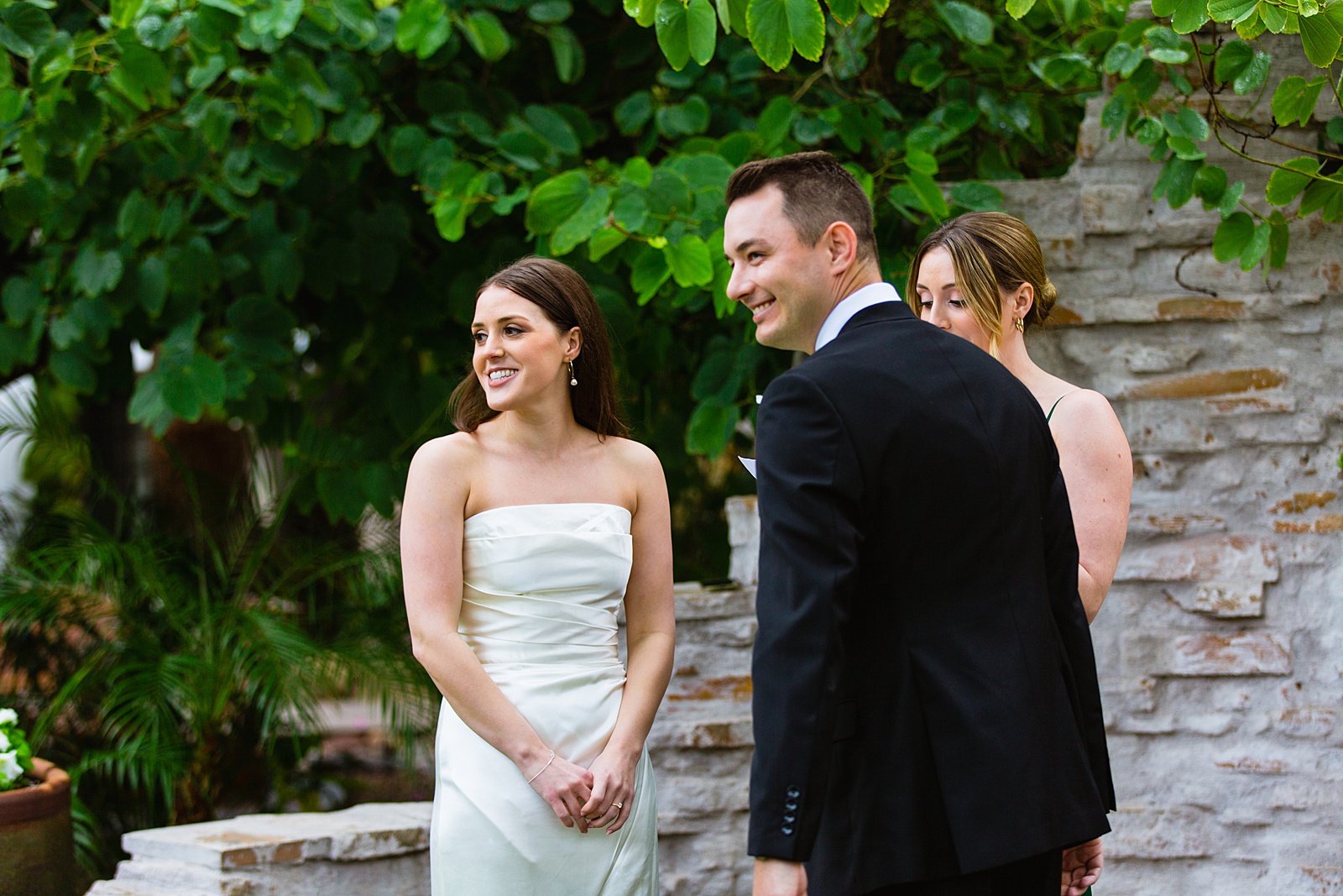 Bride & Groom laughing together during their wedding ceremony at The Scott by Phoenix wedding photographer PMA Photography.