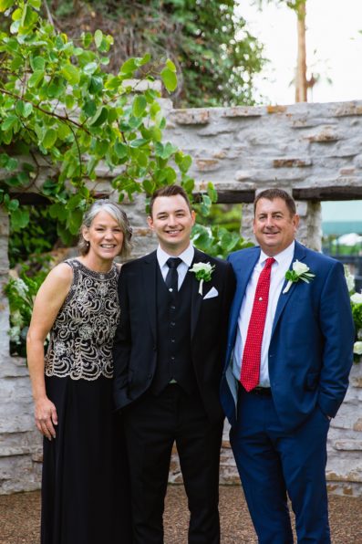 Groom and his parents together at a The Scott wedding by Arizona wedding photographer PMA Photography.