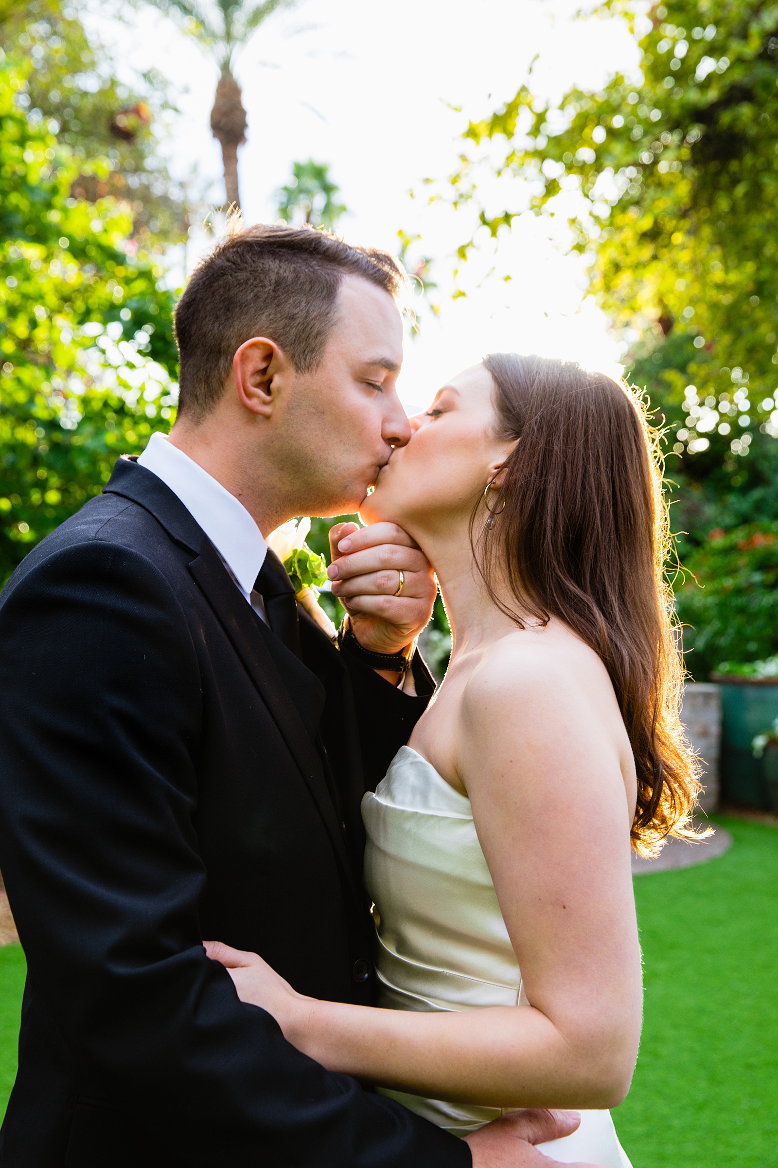 Bride & Groom share a kiss during their The Scott wedding by Arizona wedding photographer PMA Photography.
